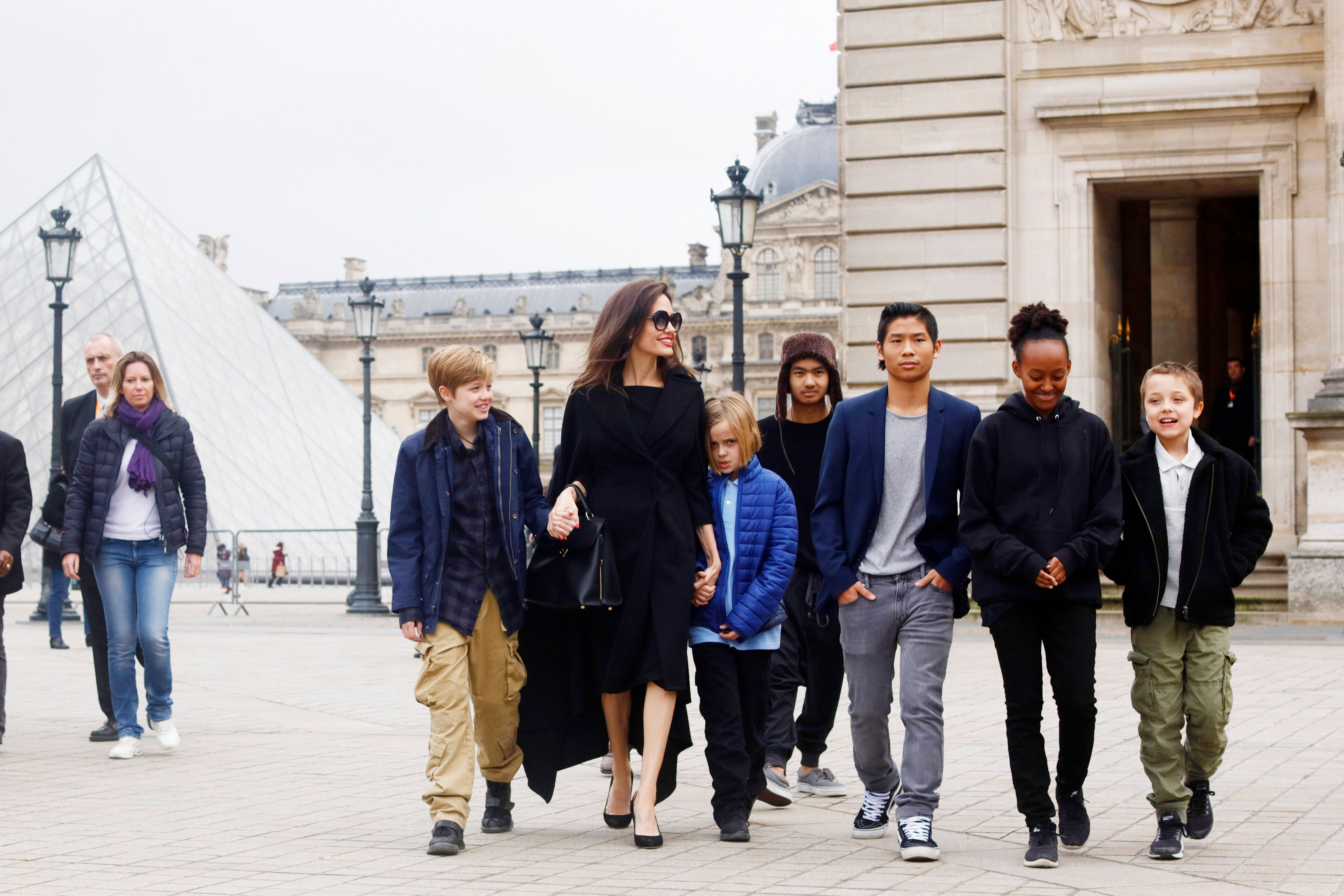 Angelina Jolie with her children Shiloh Pitt Jolie, Maddox Pitt Jolie, Vivienne Marcheline Pitt Jolie, Pax Thien Pitt Jolie, Zahara Marley Pitt Jolie, Knox Leon Pitt Jolie, visit the Louvre in Paris, France (Photo by Mehdi Taamallah/NurPhoto via Getty Images)