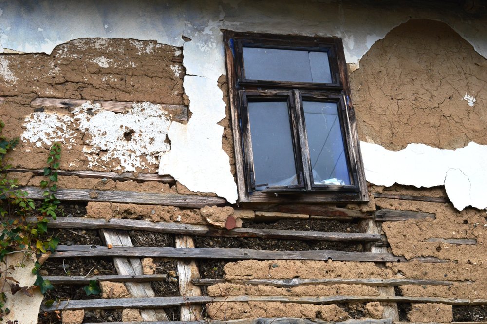 Window on old abandoned house | Shutterstock