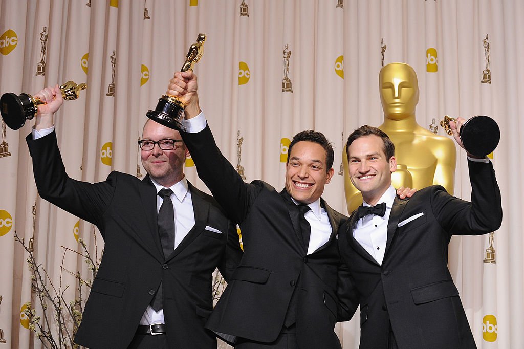 Image Credits: Getty Images / Steve Granitz/WireImage | Producer Rich Middlemas, directors T.J. Martin and Dan Lindsay pose in the press room