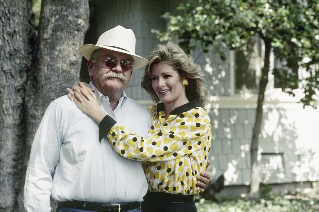 Image Credit: Getty Images / Wilford Brimley as Gus Witherspoon and Deidre Hall as Jessica 'Jessie’ Witherspoon on set for season 1 of Our House.