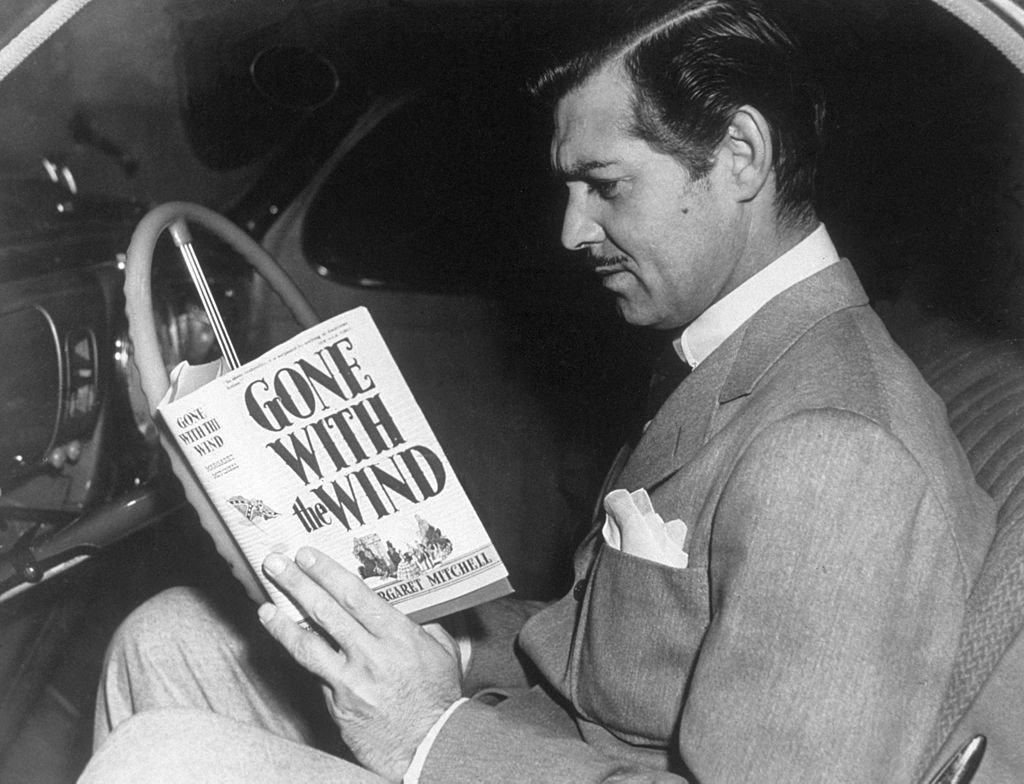 Image Credit: Getty Images / American film star Clark Gable reading the novel 'Gone With the Wind' by Margaret Mitchell Image Credit: Getty Images / American film star Clark Gable reading the novel 'Gone With the Wind' by Margaret Mitchell