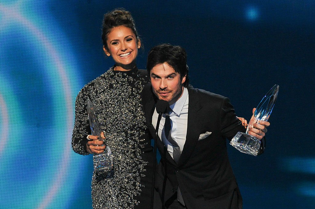 Image Source: Getty Images/Allen Berezovsky/Actors Nina Dobrev (L) and Ian Somerhalder, winners of the Favorite On Screen Chemistry award for 'The Vampire Diaries,' speak onstage at the 40th Annual People's Choice Awards