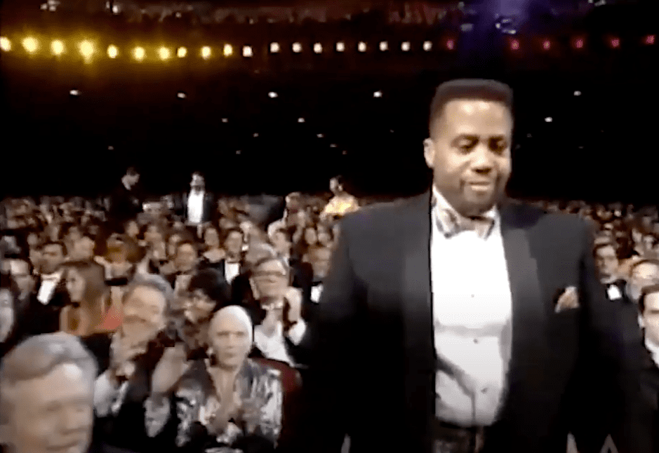 Image Credits: YouTube / ViolentHuesProd | Russel Williams II stepping onstage to accept his Oscar