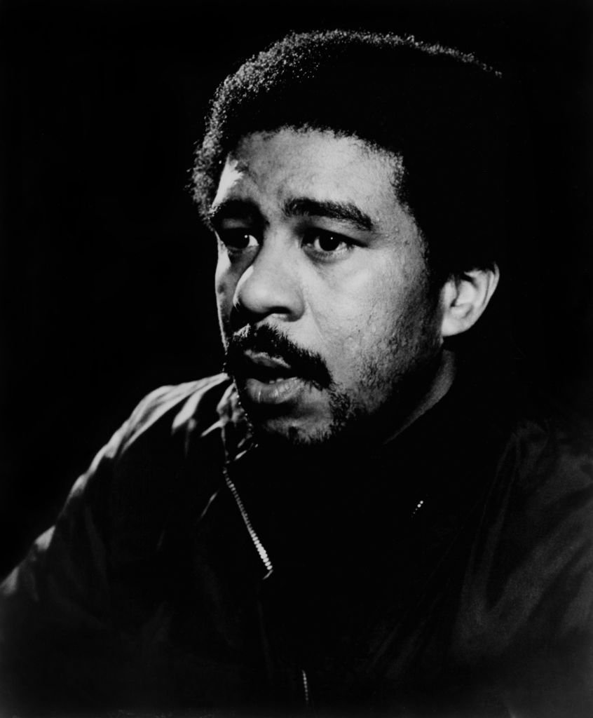 Image Credits: Getty Images / Michael Ochs Archives | Richard Pryor posing for a Stax Records publicity photo in 1974