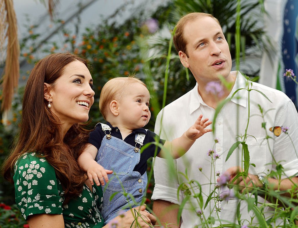 Image Credit: Getty Images / Catherine, Duchess of Cambridge holds Prince George with Prince William. The family released the photo ahead of the first birthday of Prince George on July 22.