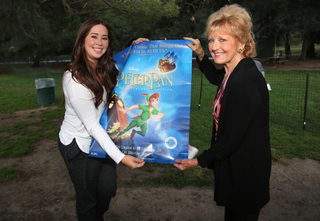 Voice Actress of "Wendy" Kathryn Beaumont and fan attend the Street Food Cinema Presents 65th Anniversary Screening Of Disney's "Peter Pan" at Griffith Park | Getty Images / Global Images Ukraine